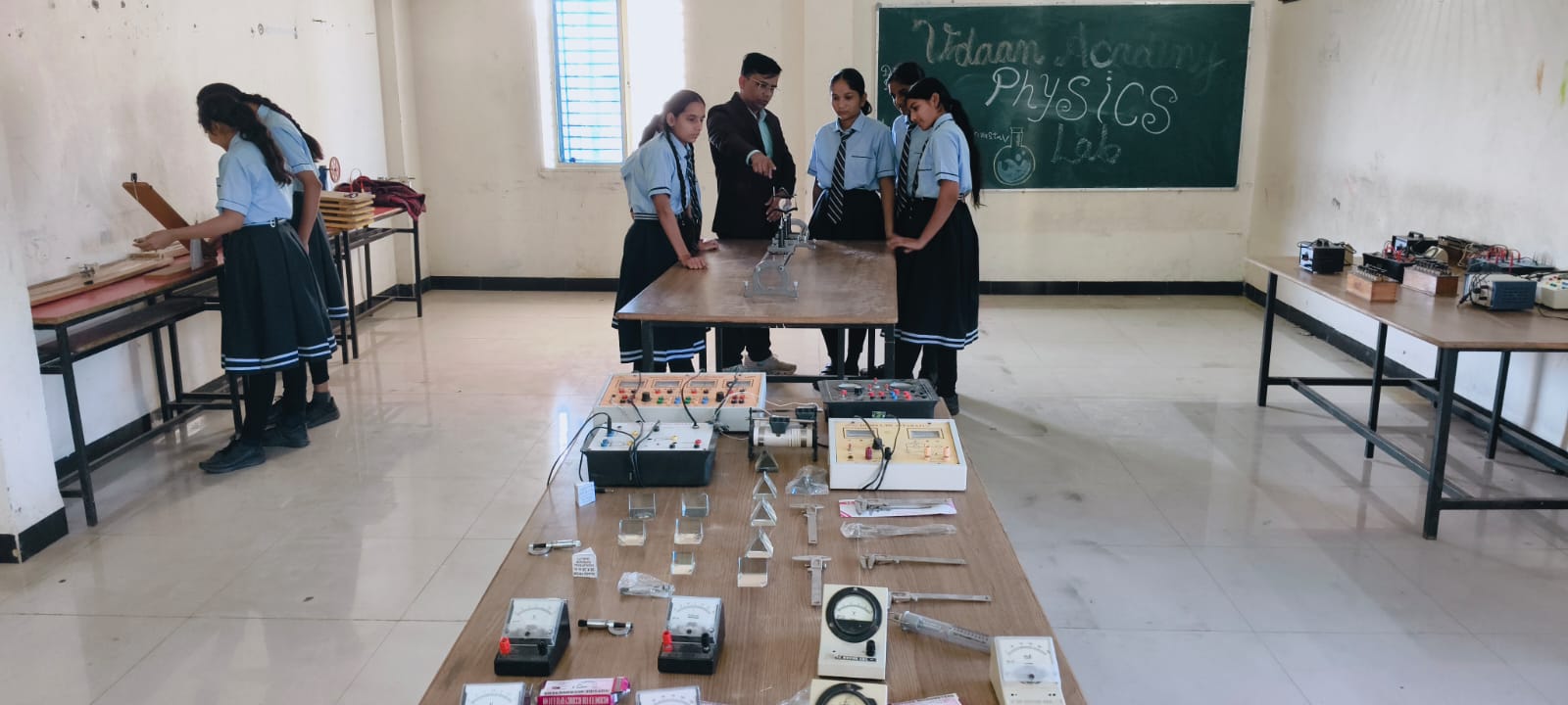 Students engaged in collaborative group study session at Udaan Academy, demonstrating peer learning and academic cooperation